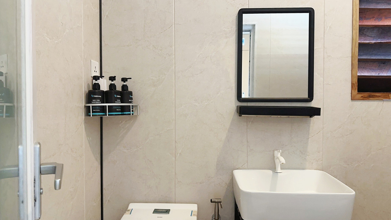 A functional simple bathroom at Sunny Holiday, an overwater resort in the Celebes Sea.